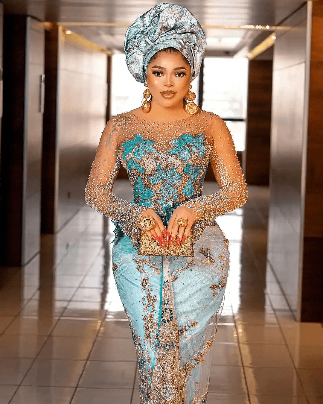 Bobrisky Adorning a Dress