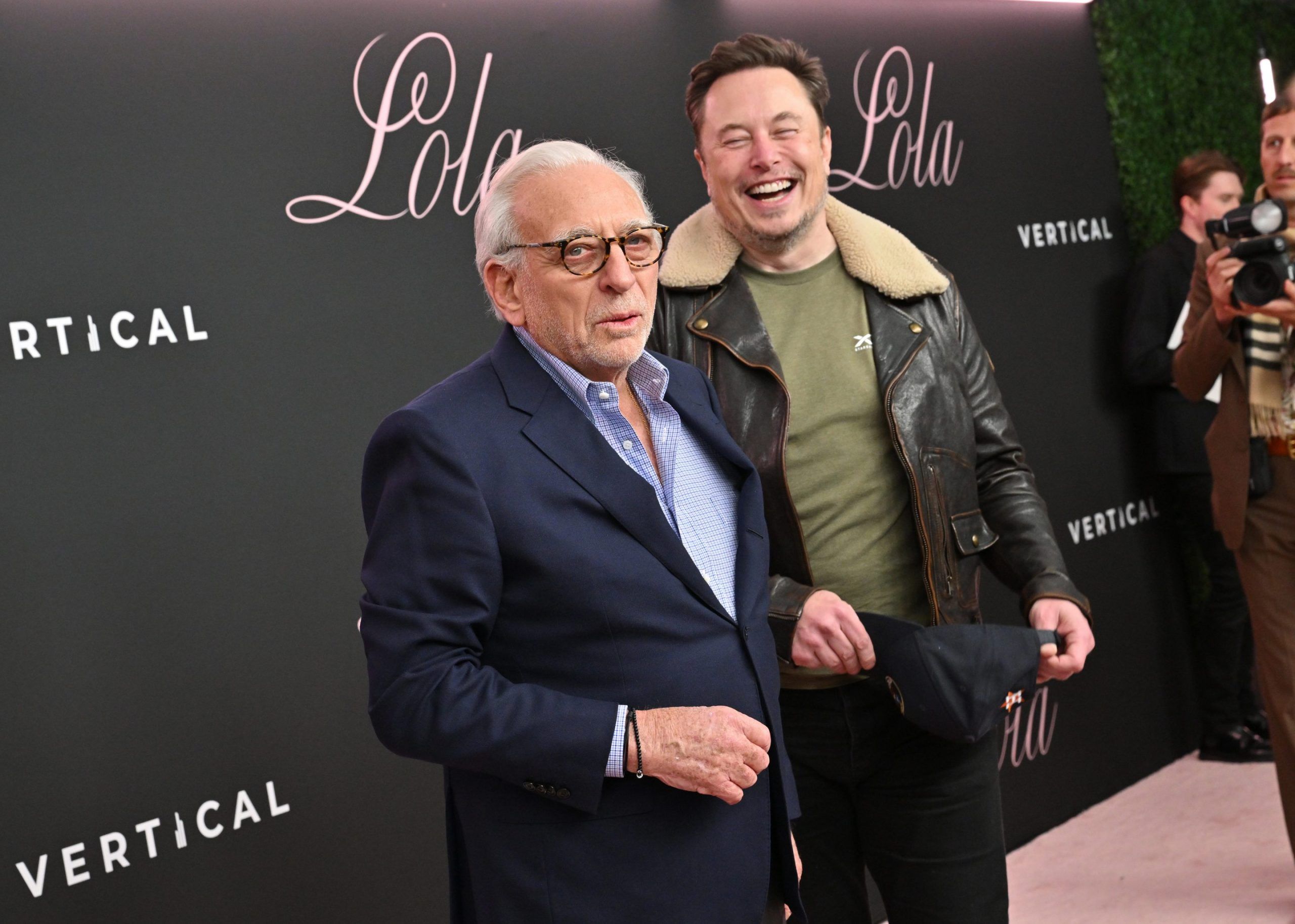 From Left, Nelson Peltz with Elon Musk by the Right