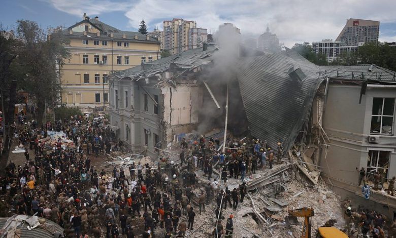 Ukrainians have been observing a day of mourning after a spate of Russian missile attacks killed dozens of civilians on Monday and the search for survivors is ongoing at a flattened children’s hospital.